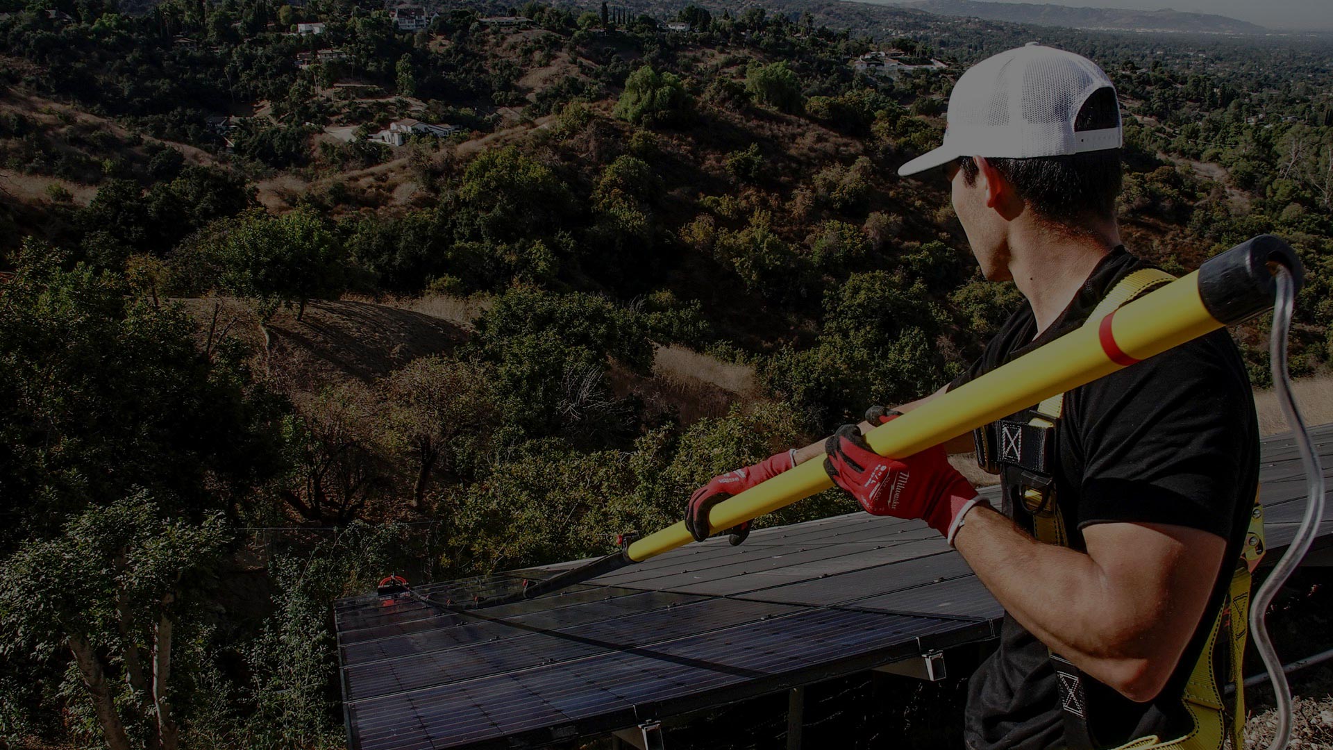 Man Cleaning Solar Panels
