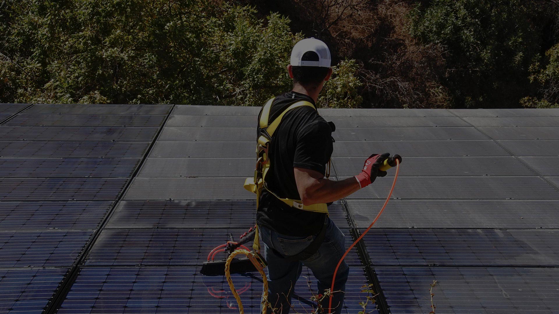 Man Cleaning Solar Panels